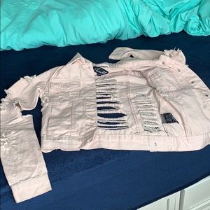 Light pink ripped denim jacket